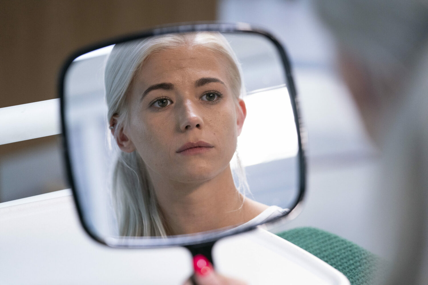 Lola Pearce looking in the mirror