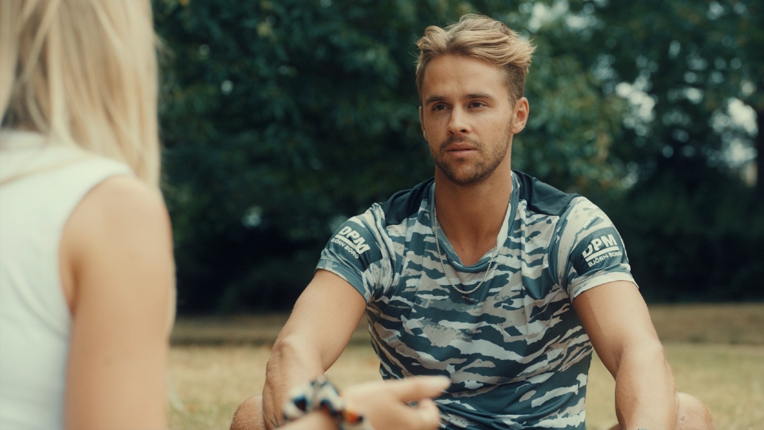 Julius Cowdrey sitting on the floor in Made In Chelsea