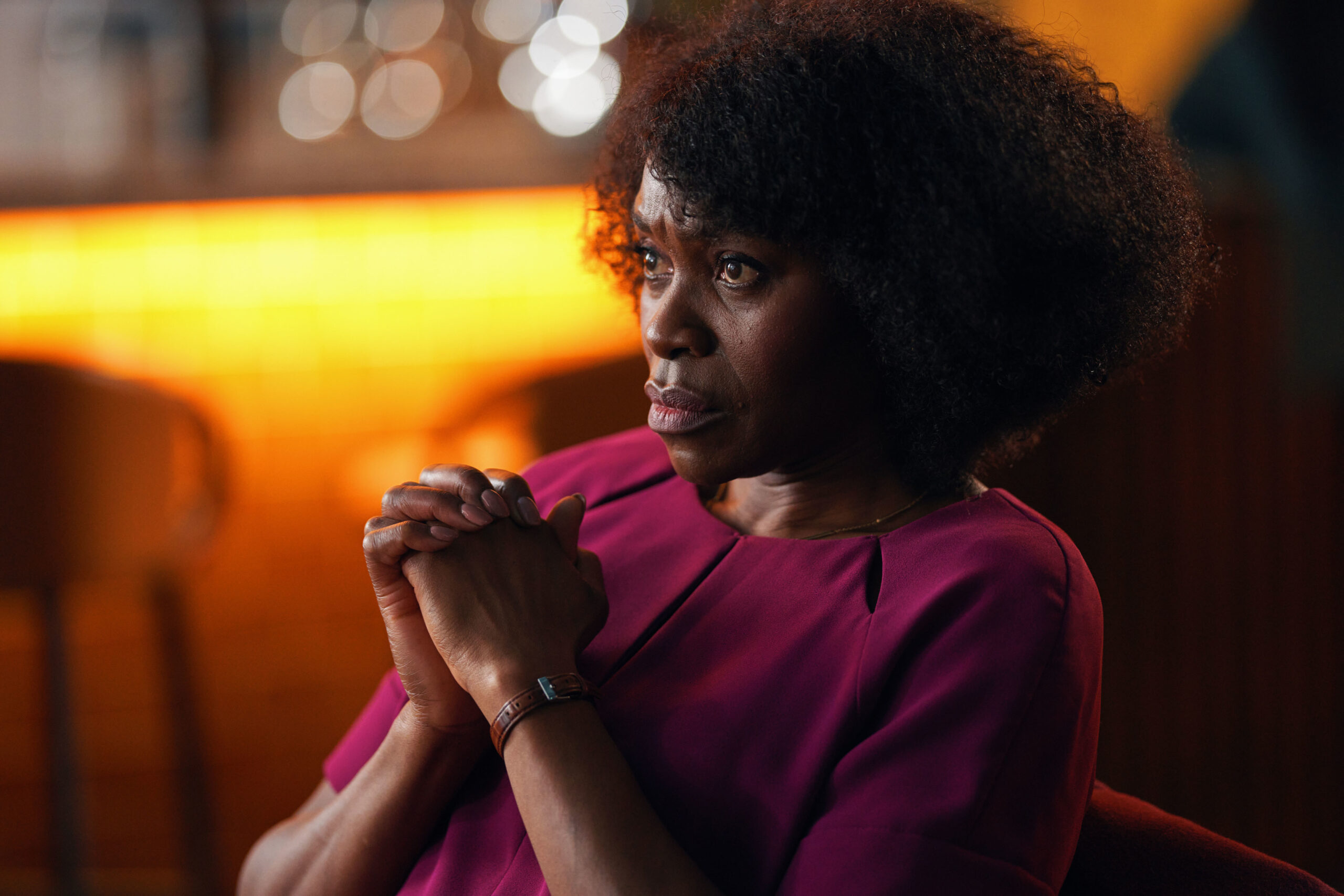 Rakie Ayola sitting in chair looking pensive as Christine in The Pact 2