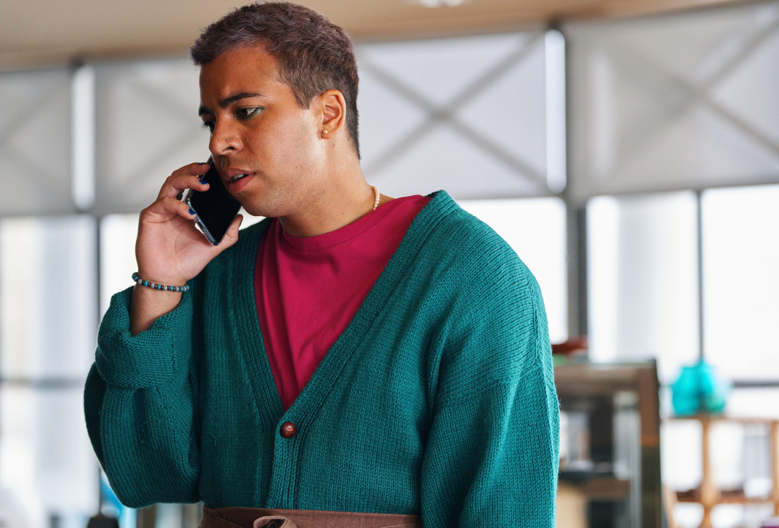 Aaron Anthony as Jamie in The Pact series 2 cast speaking into a phone and looking anxious