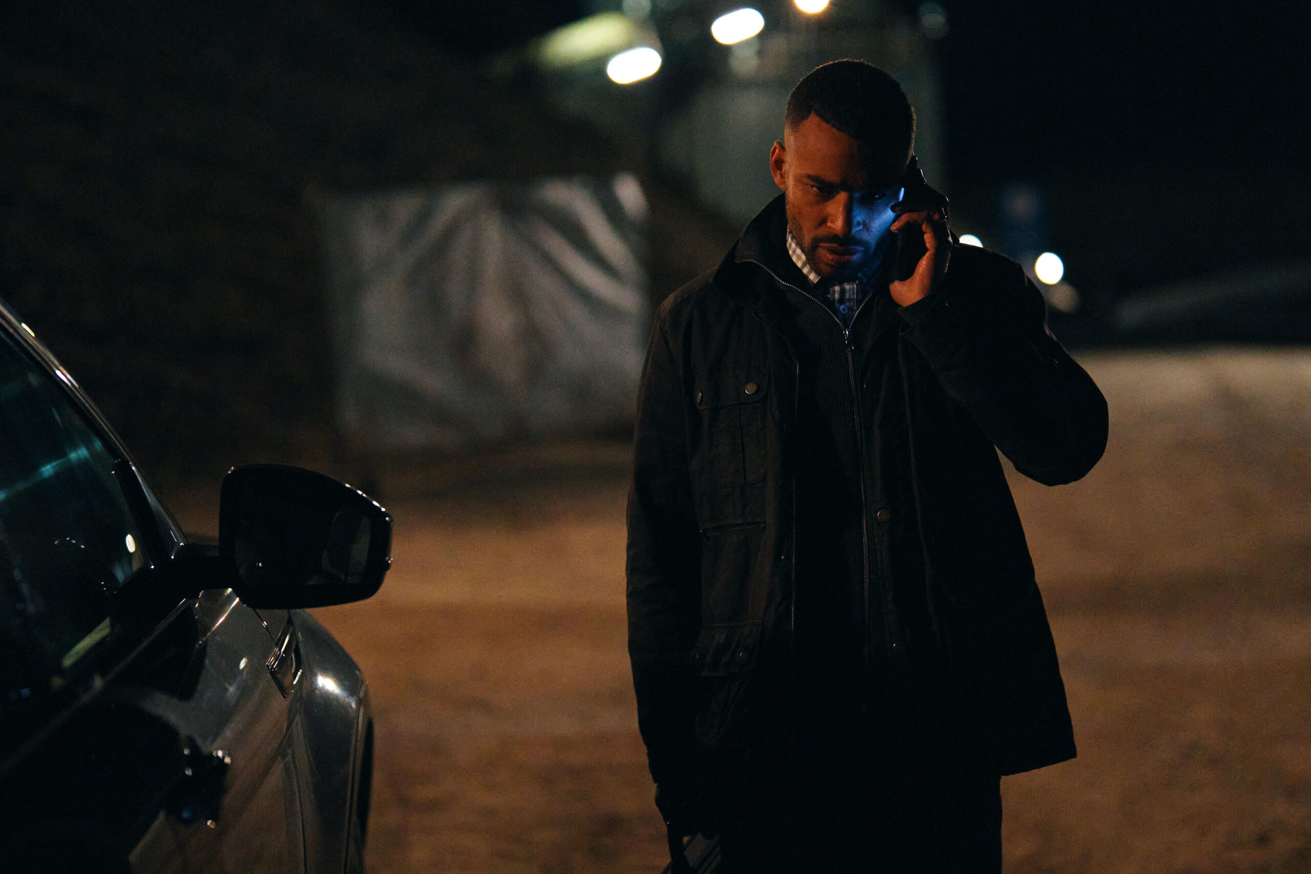 Will (Lloyd Everitt) speaking into phone looking concerned, in The Pact series 2 episode 1