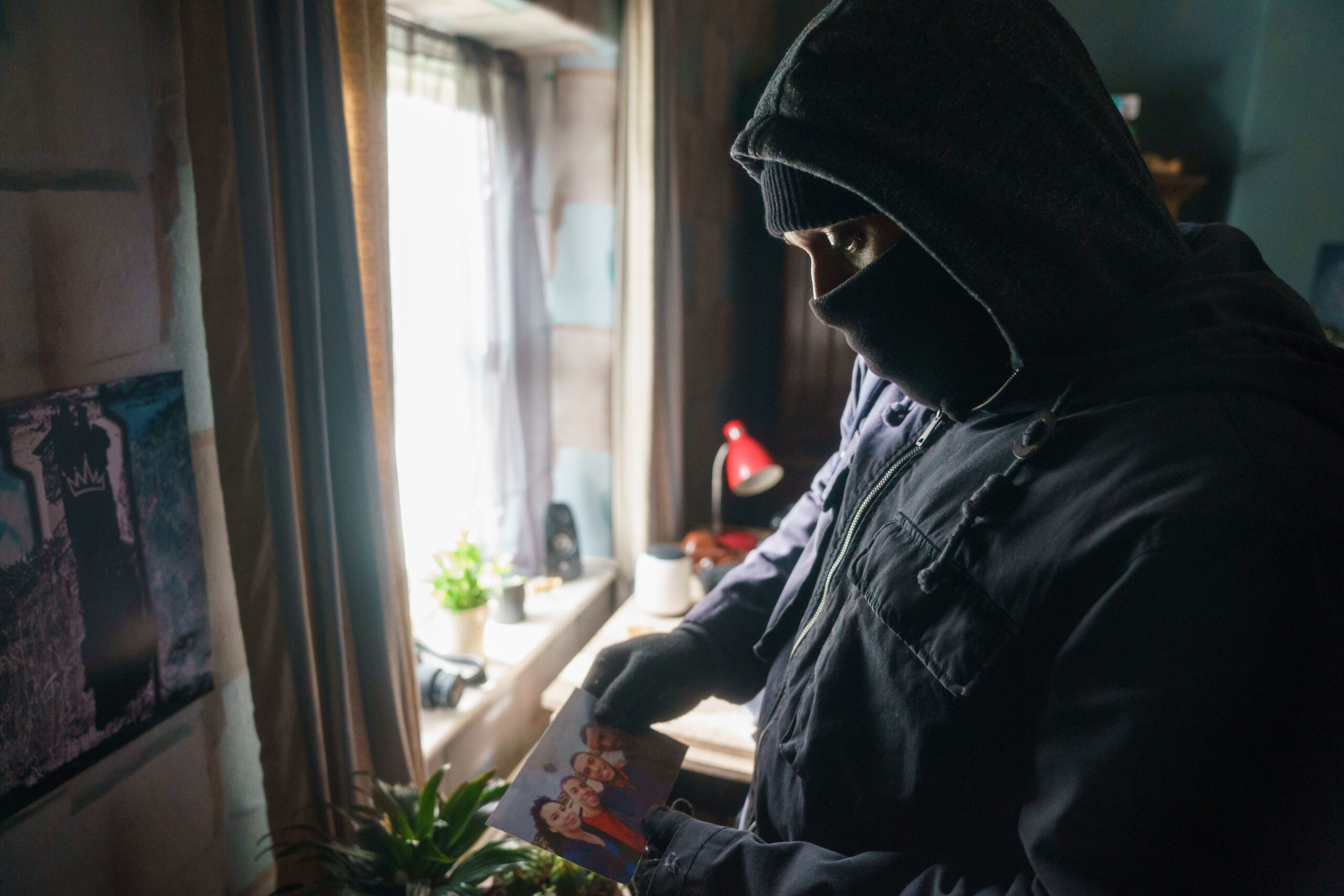 Connor in Christine's house after breaking in, wearing a balaclava, in The Pact series 2 episode 1