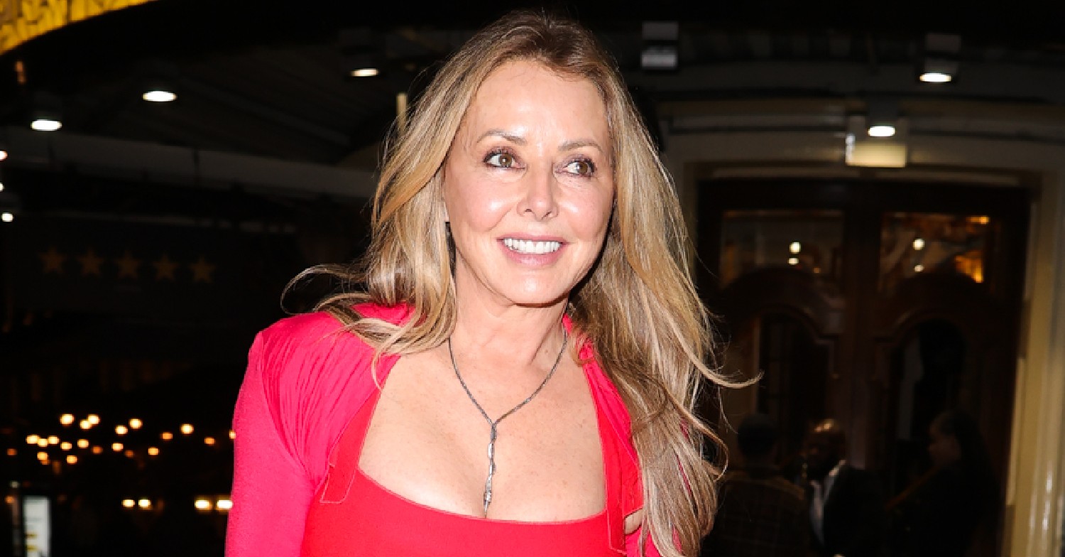 Carol Vorderman smiles in red dress on night out