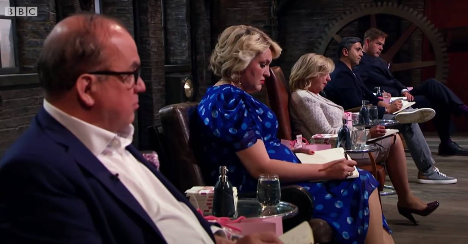 Dragons' Den stars listen to Drew Cockton pitch