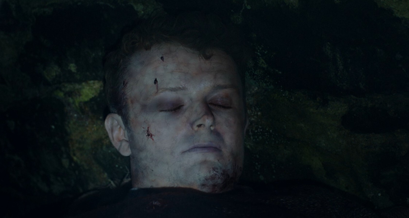 Birdy's body (Chris Walley) sat in a dark shed, he is blue and covered in cuts in the Bloodlands finale