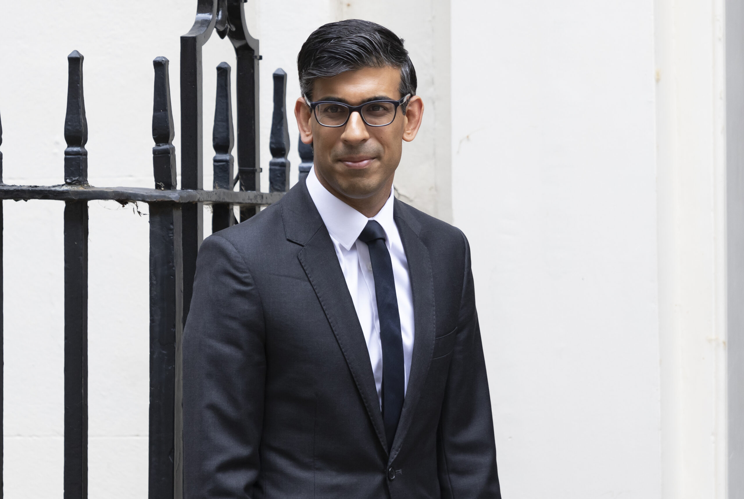 Prime Minister Rishi Sunak wearing glasses