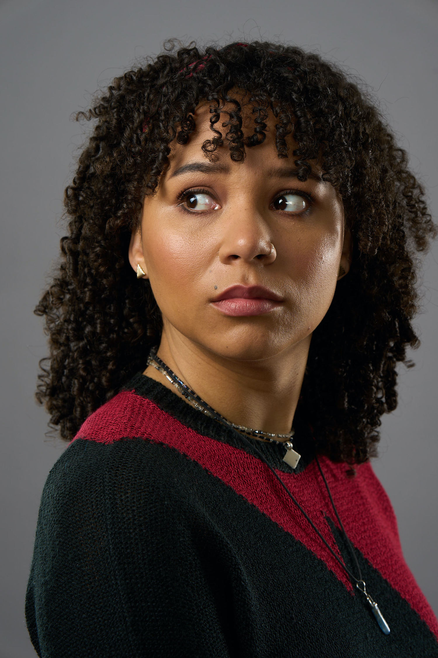 Mali Ann Rees as Megan in The Pact series 2, looking over her shoulder, worried