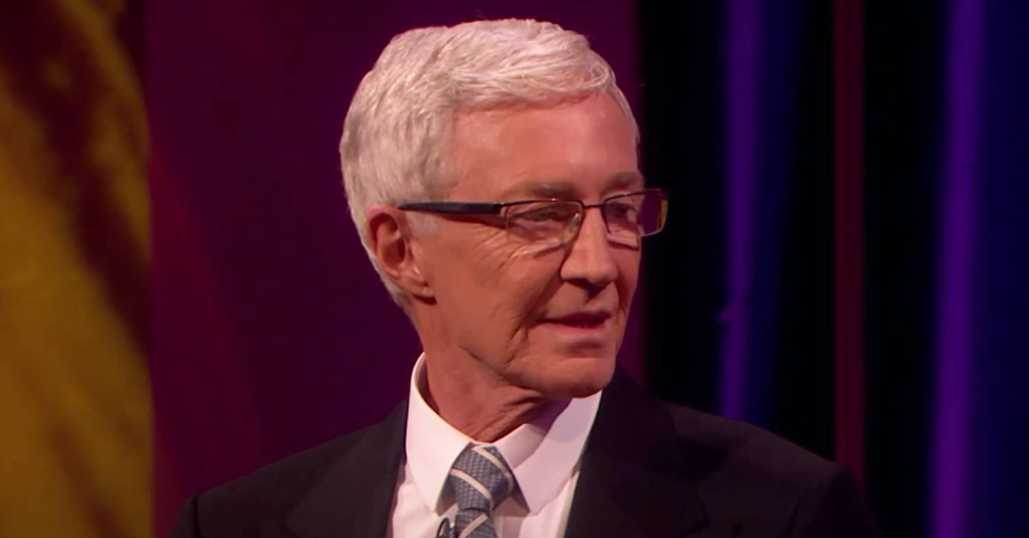 Paul O'Grady looks to the side