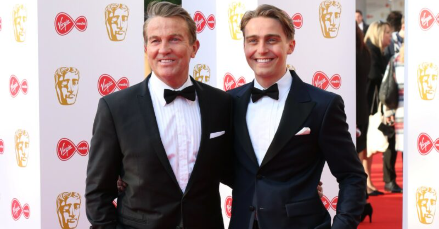 Bradley and Barney posing on the red carpet 