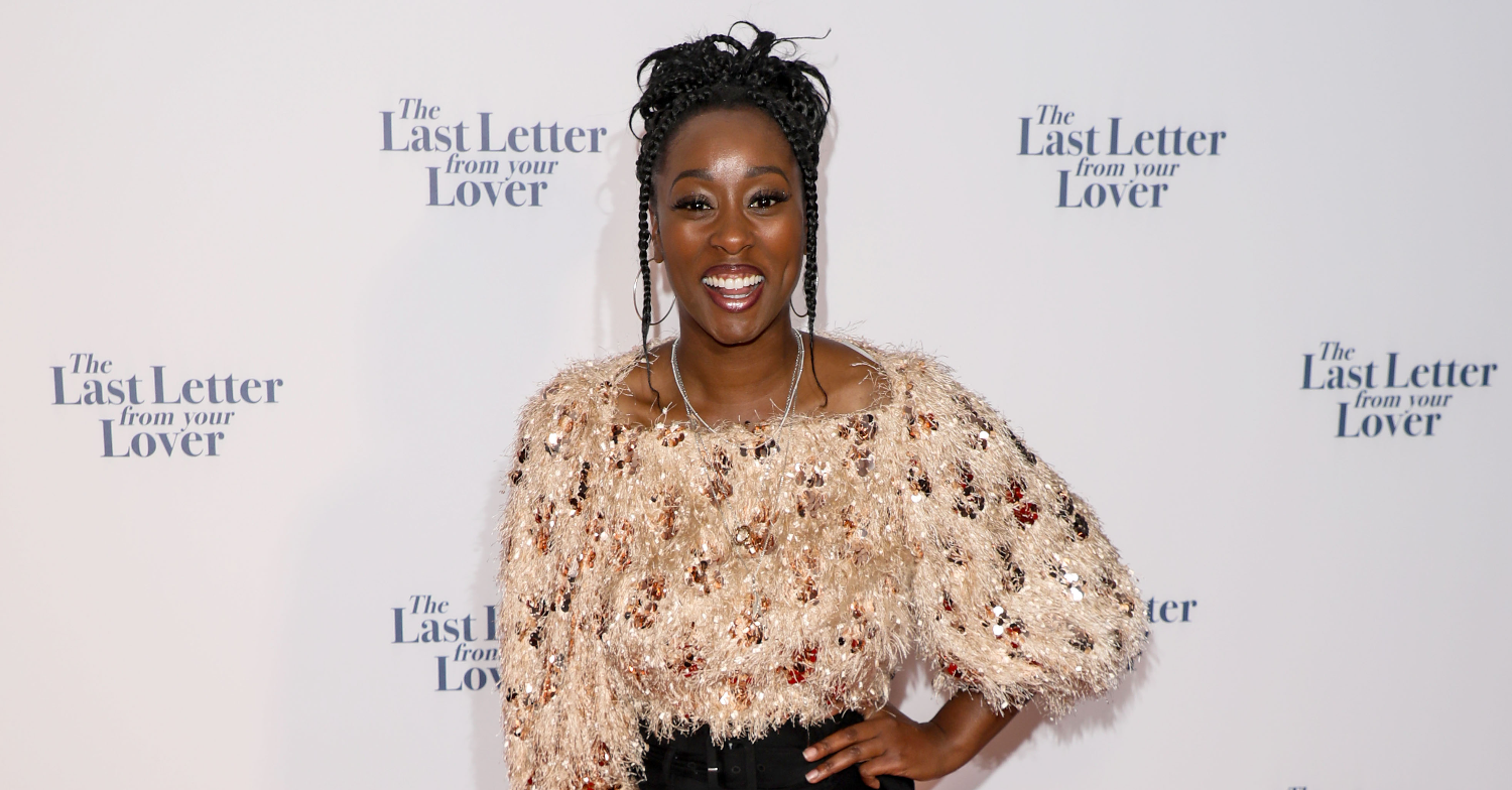 Scarlette Douglas posing and smiling on the red carpet