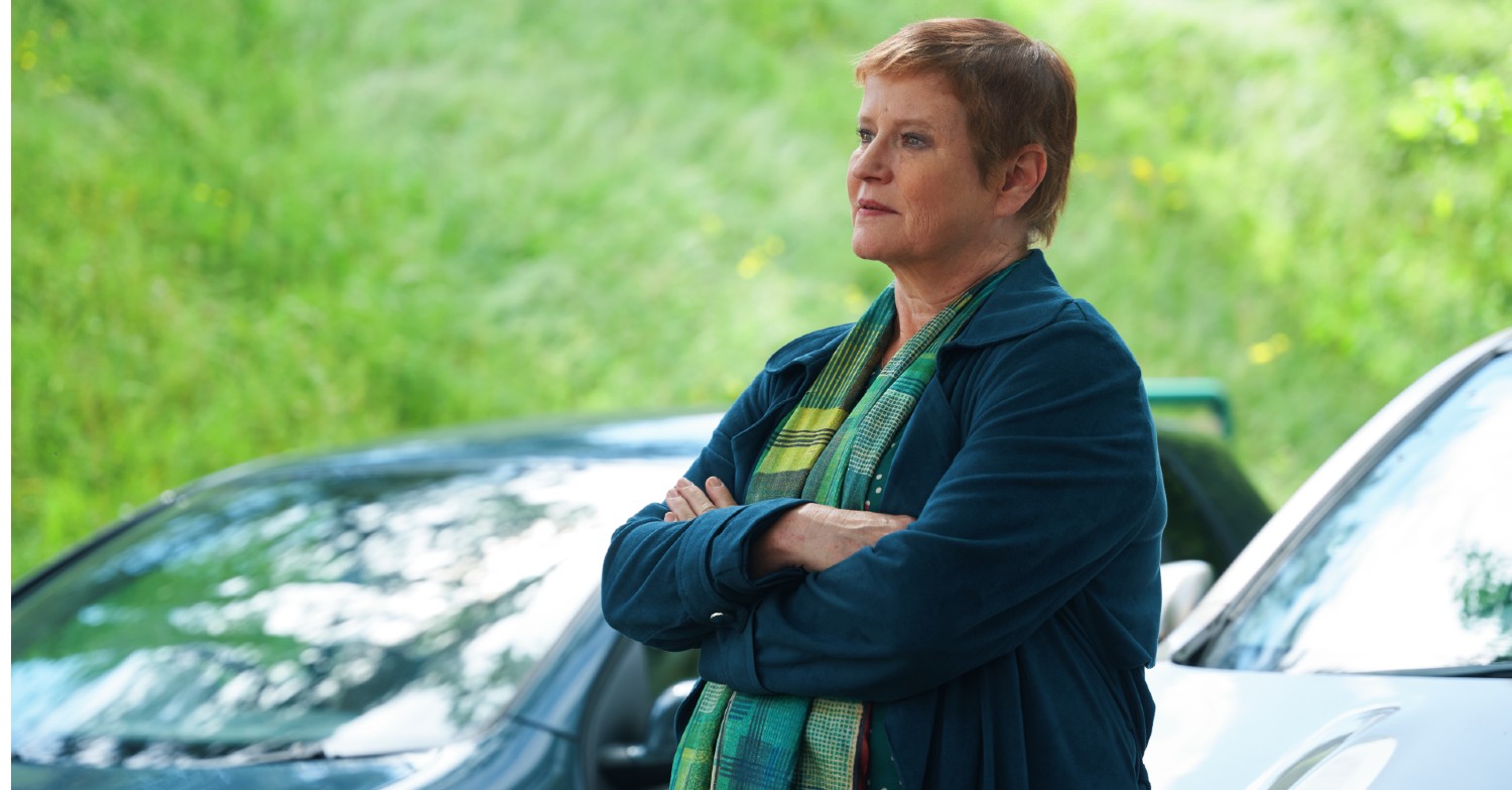 Beth (Lisa Palfrey) standing beside her car in The Pact series 2