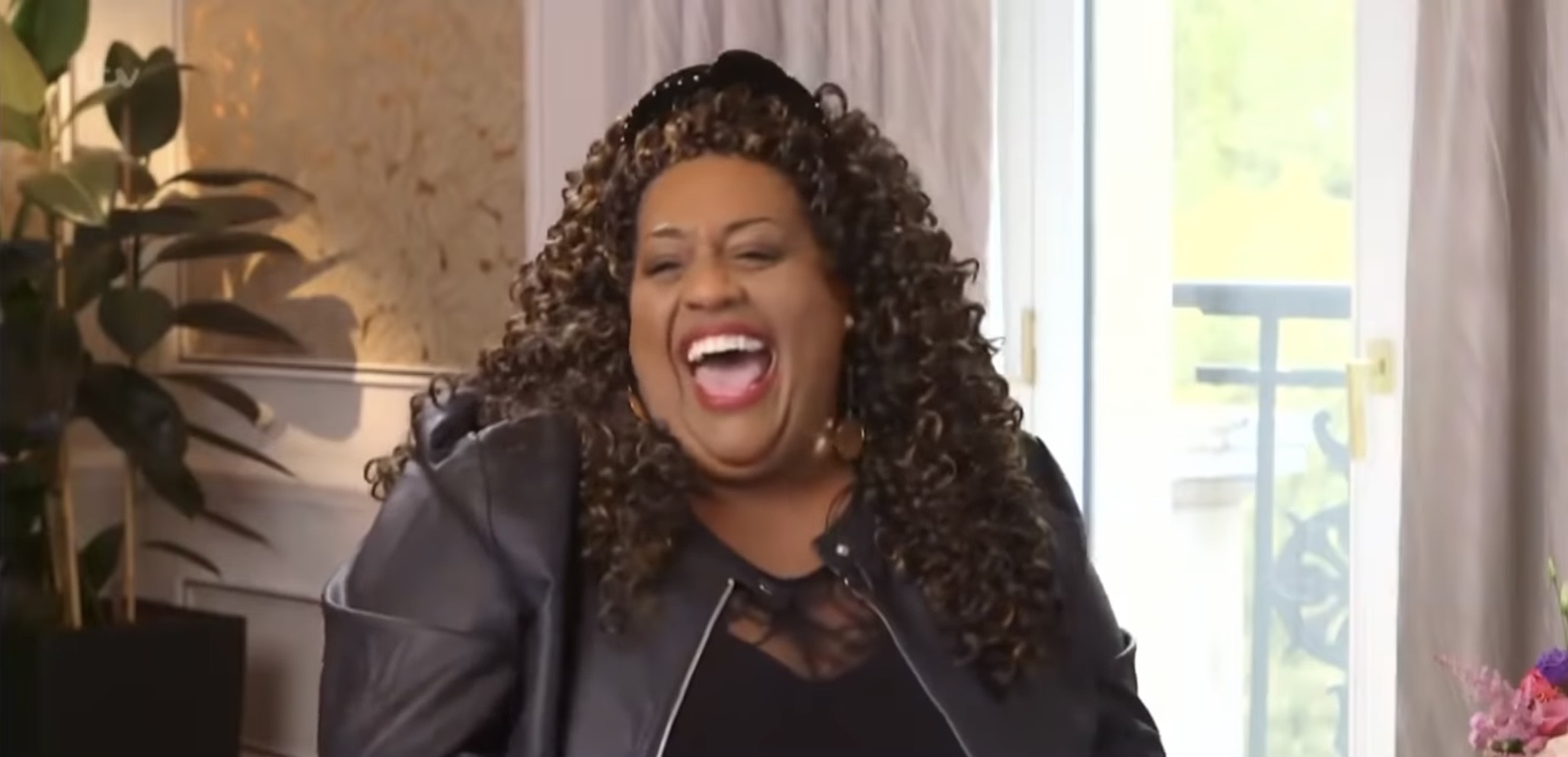 Alison Hammond laughing with her hair half up
