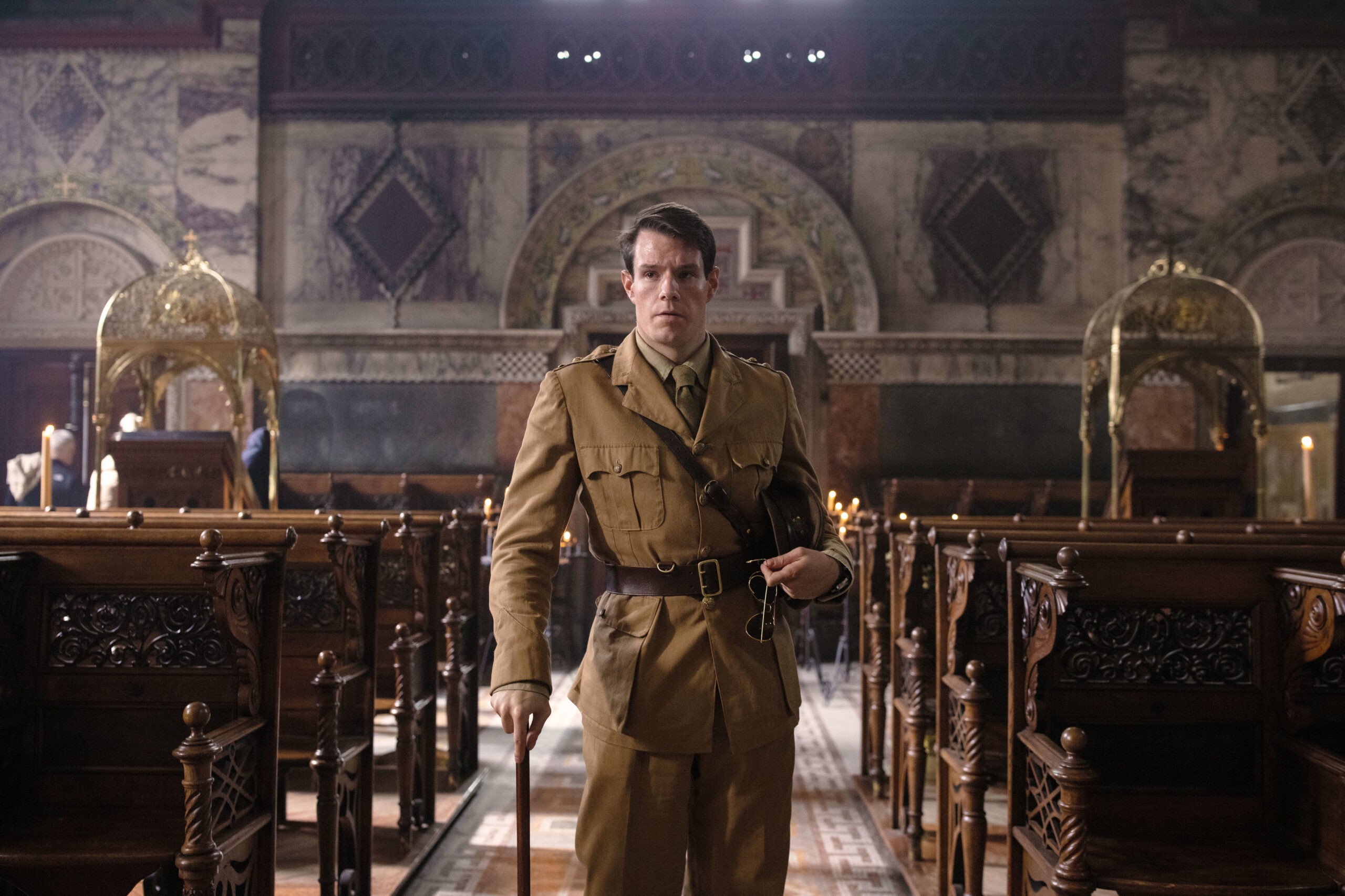 Connor Swindells walking with a cane in SAS Rogue Heroes