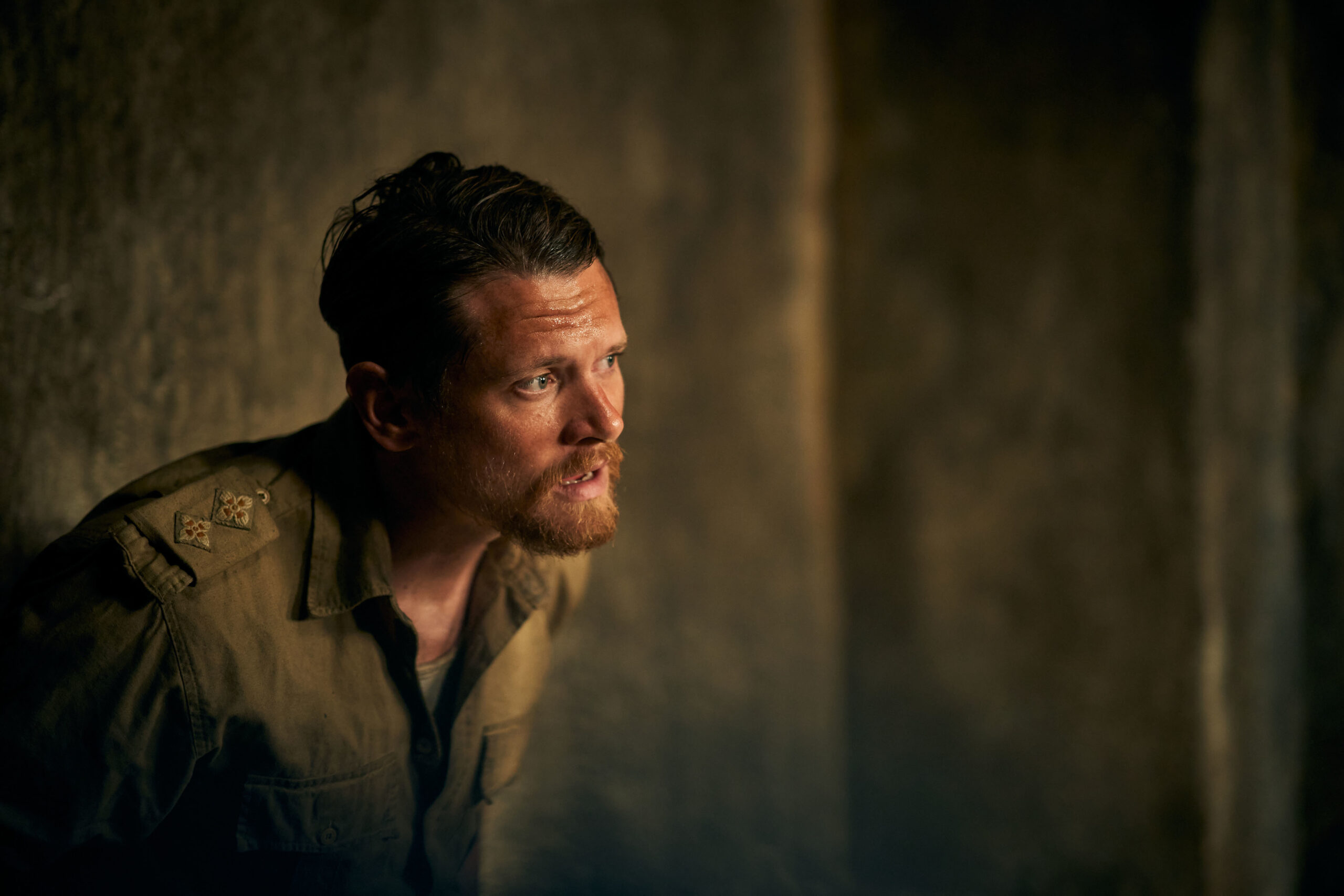 Jack O'Connell looking confused in SAS Rogue Heroes