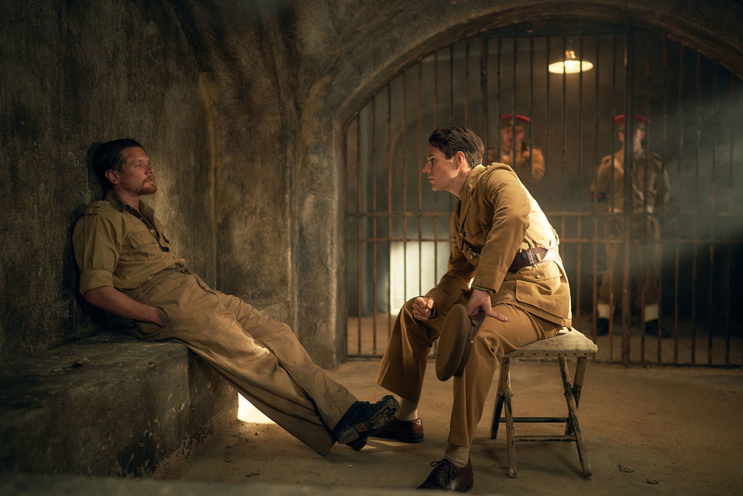 Jack O'Connell and Connor Swindells sitting together