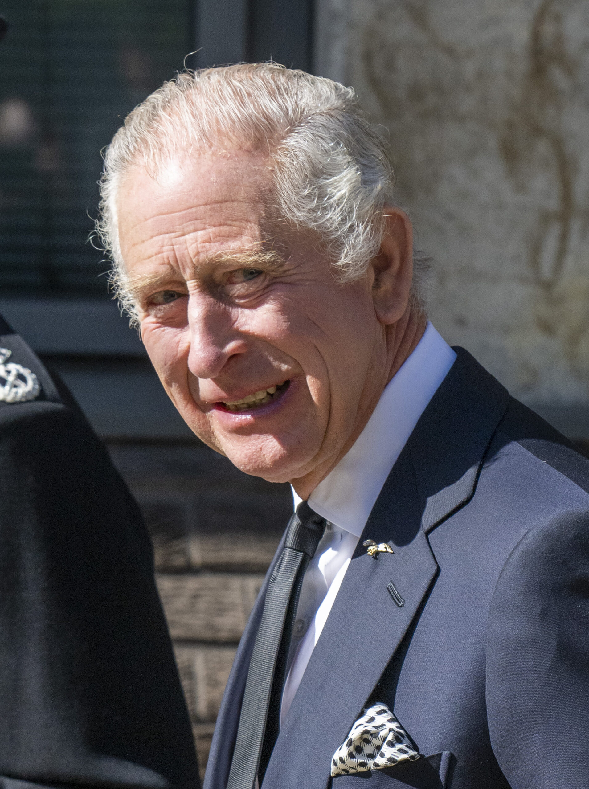 King Charles III smiles as he visits Lambeth Met HQ 