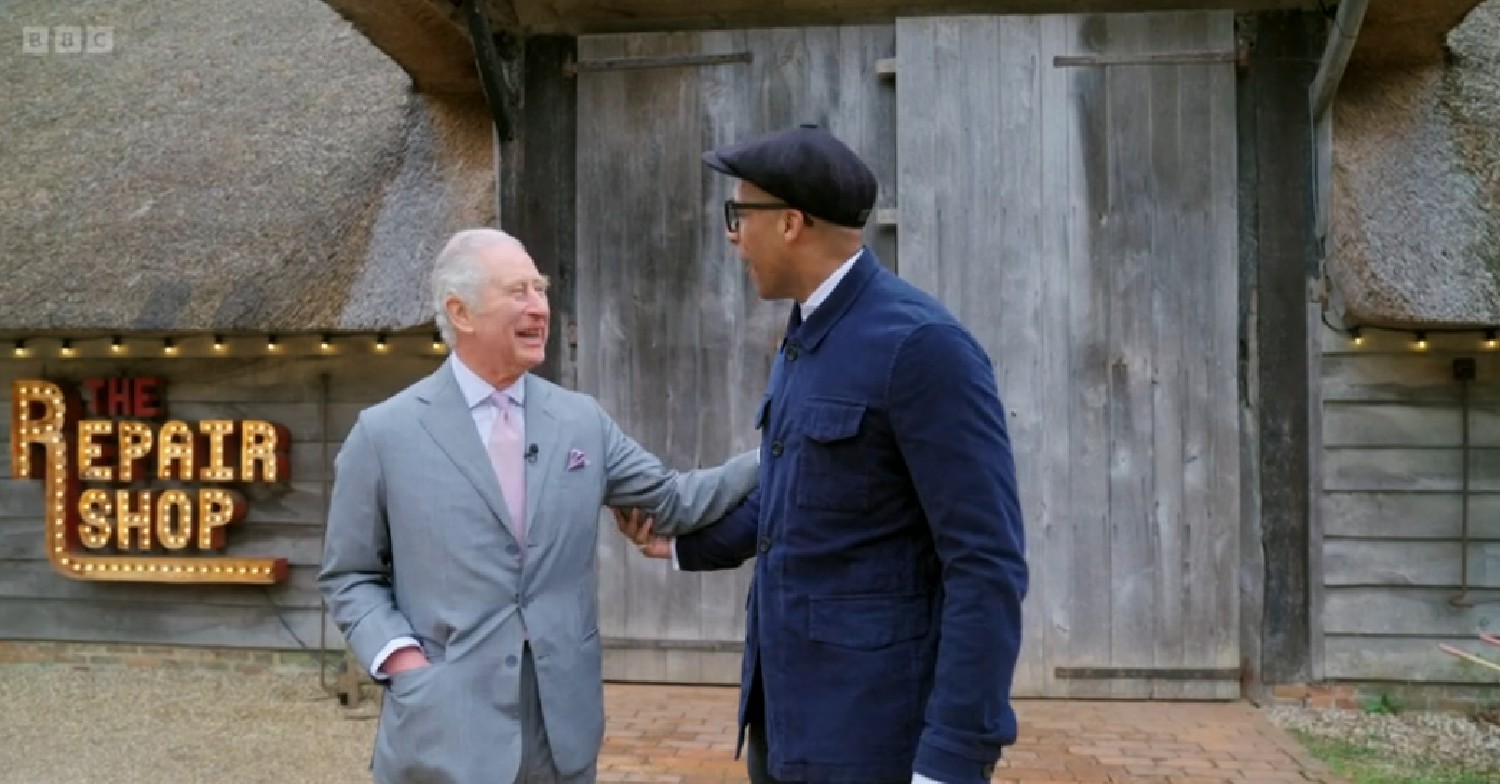 Jay Blades and King Charles touching each other on The Repair Shop