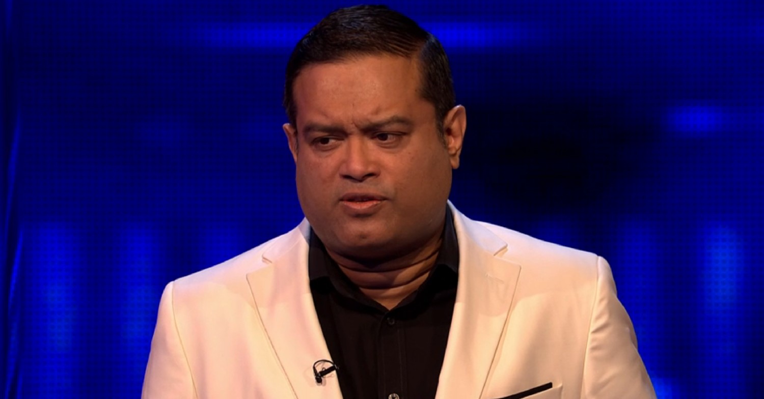 Paul Sinha wearing a white suit on The Chase 