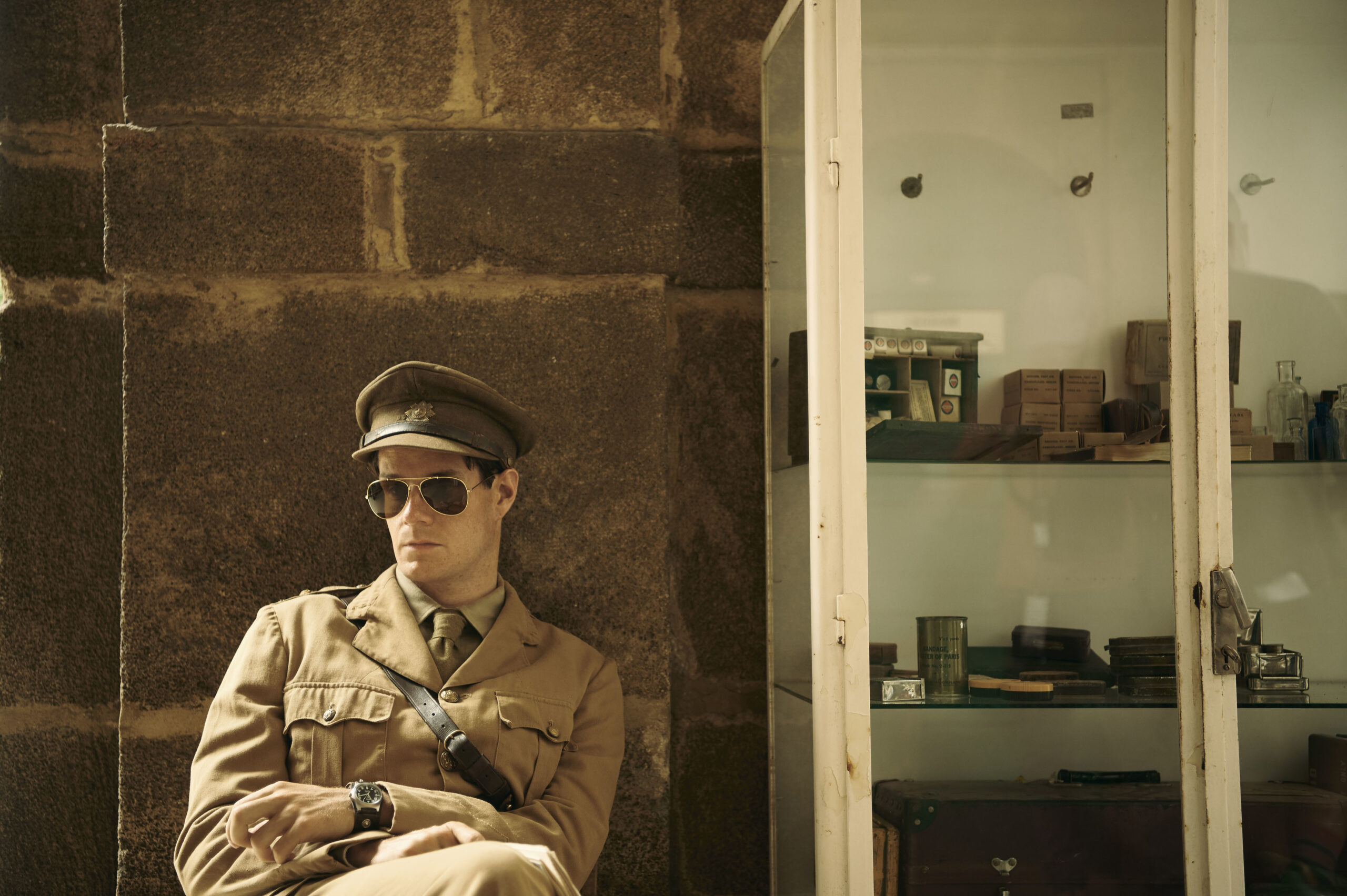 David Stirling leans against the wall in his shades SAS Rogue Heroes