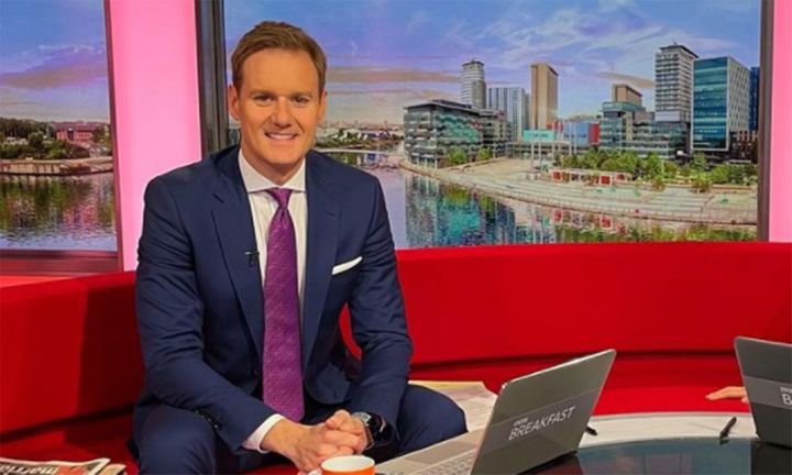 Dan Walker smiling on the BBC Breakfast red sofa