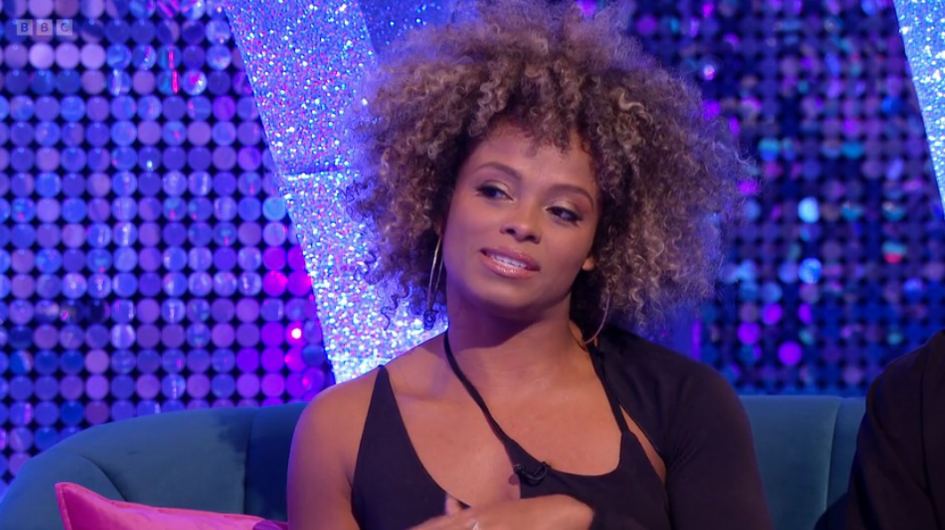 Fleur East tilting her head and talking on Strictly It Takes Two
