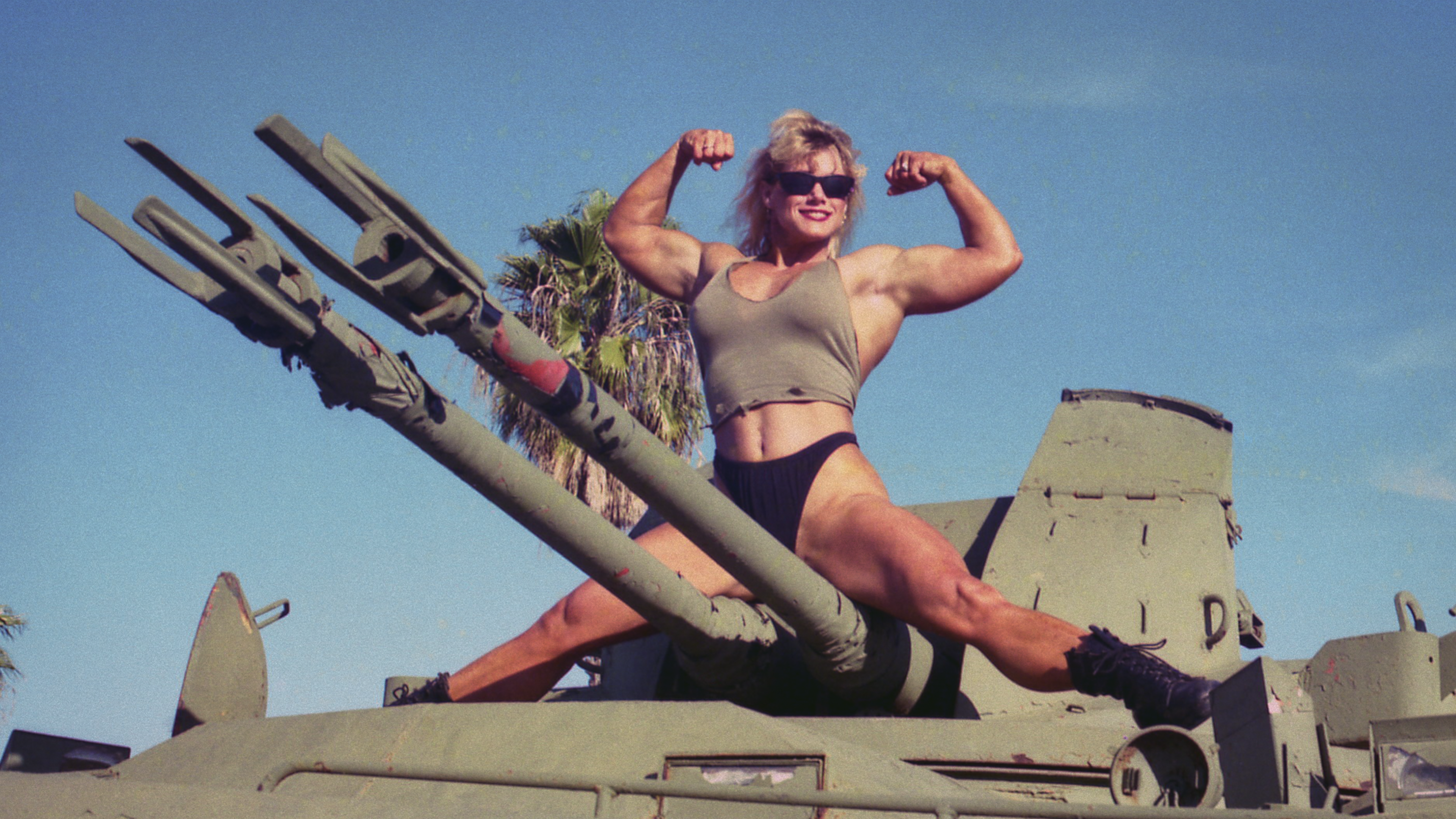 Sally McNeil poses on a tank in Netflix series Killer Sally
