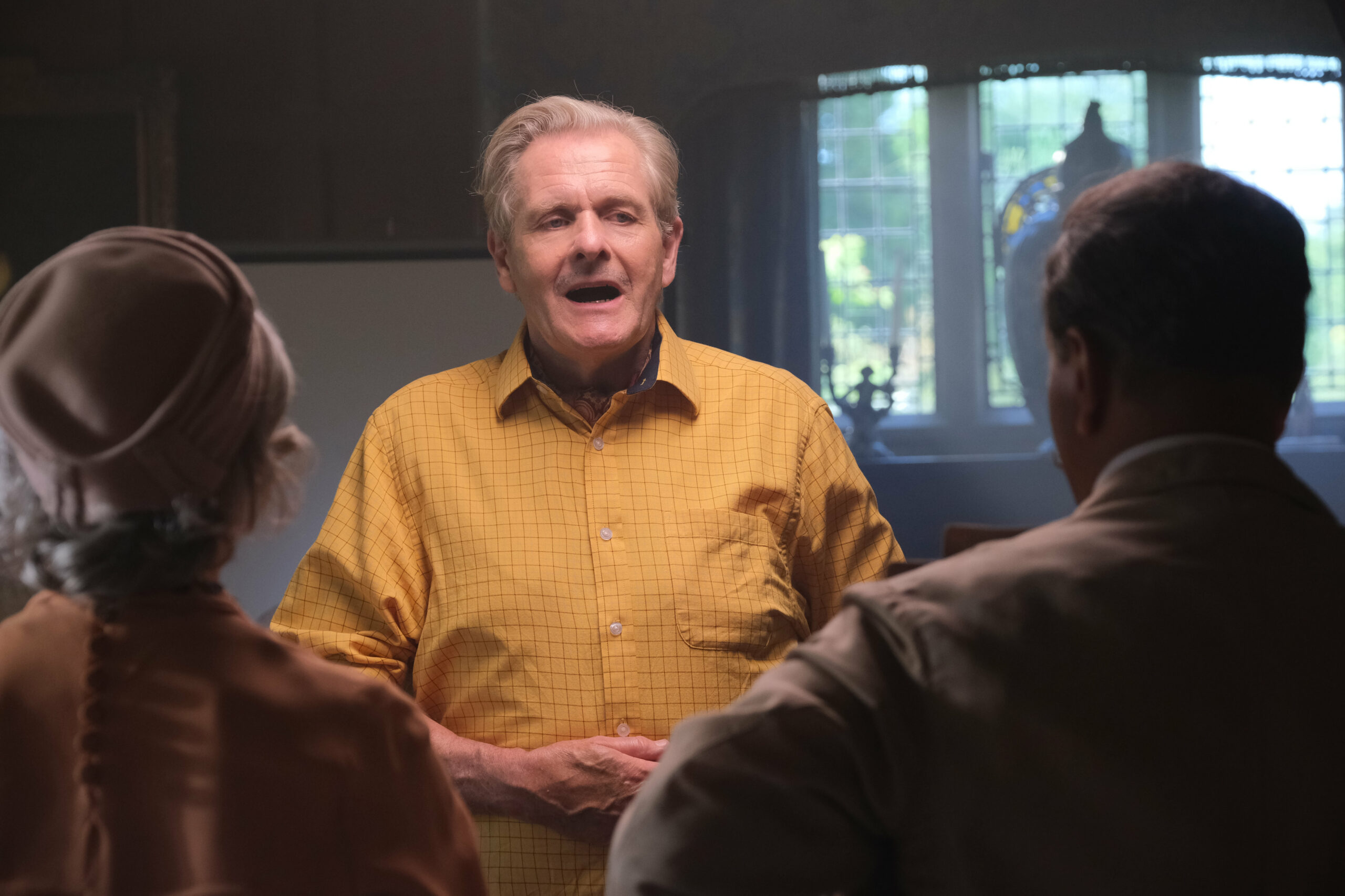 Johnny Delamere talking to guests in The Larkins