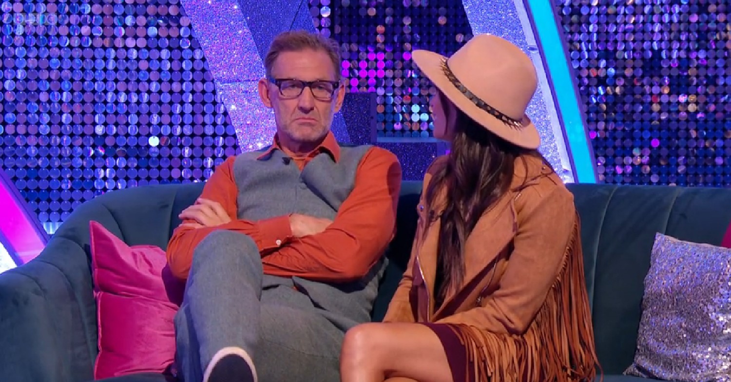 Tony Adams speaking as Katya Jones looks at him on Strictly It Takes Two