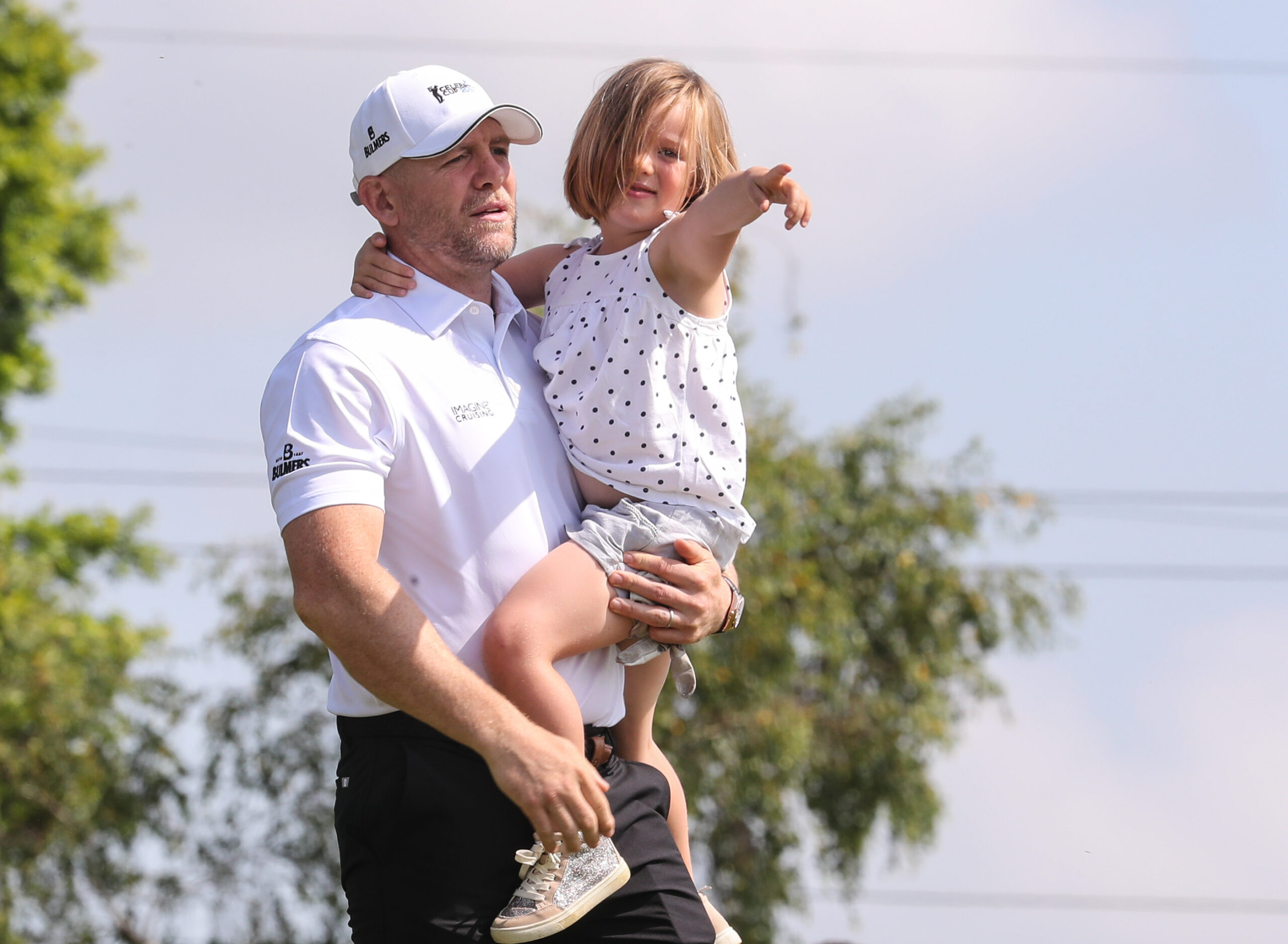 Mike Tindall holding his little girl Mia