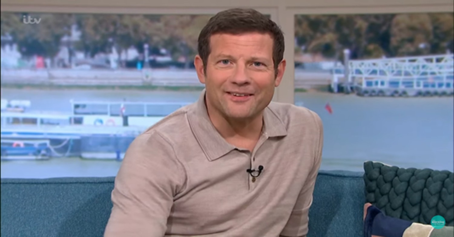 Dermot OLeary smiling at camera while sat on This Morning sofa today