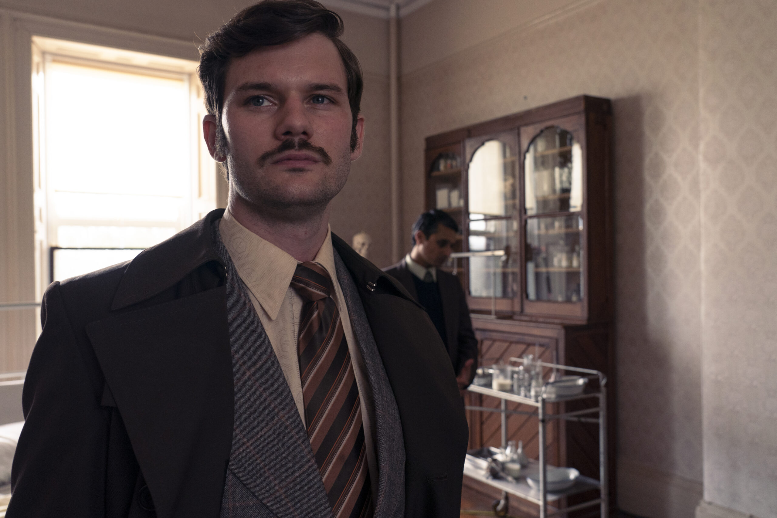 DS Masterson stands up with a proud smirk