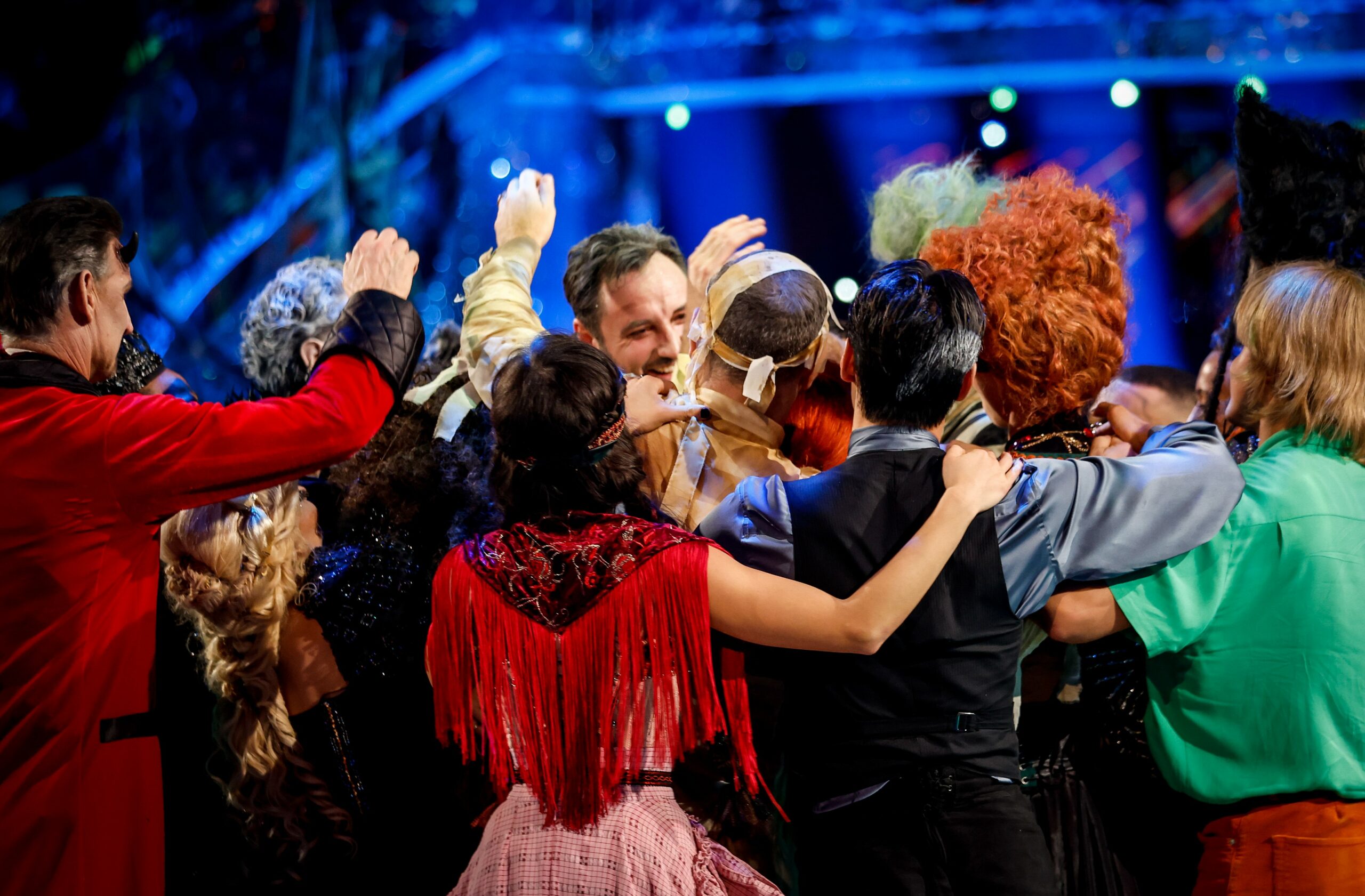 James Bye hugged by Strictly stars during results show