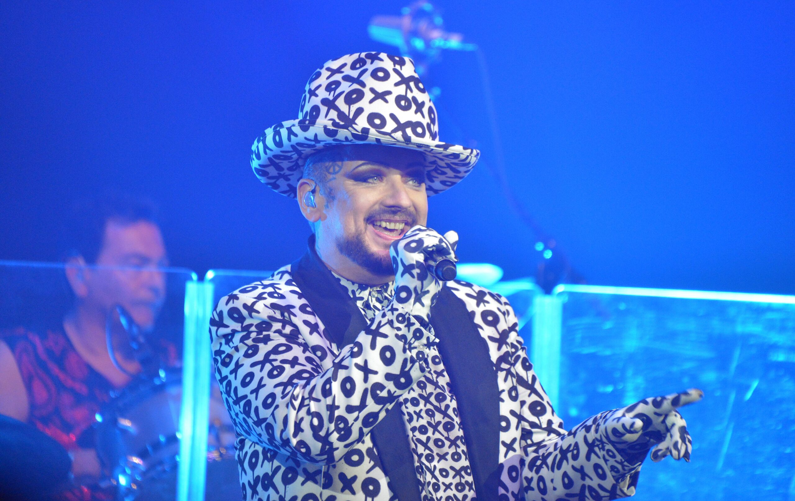 I'm A Celebrity star Boy George singing in a black and white outfit