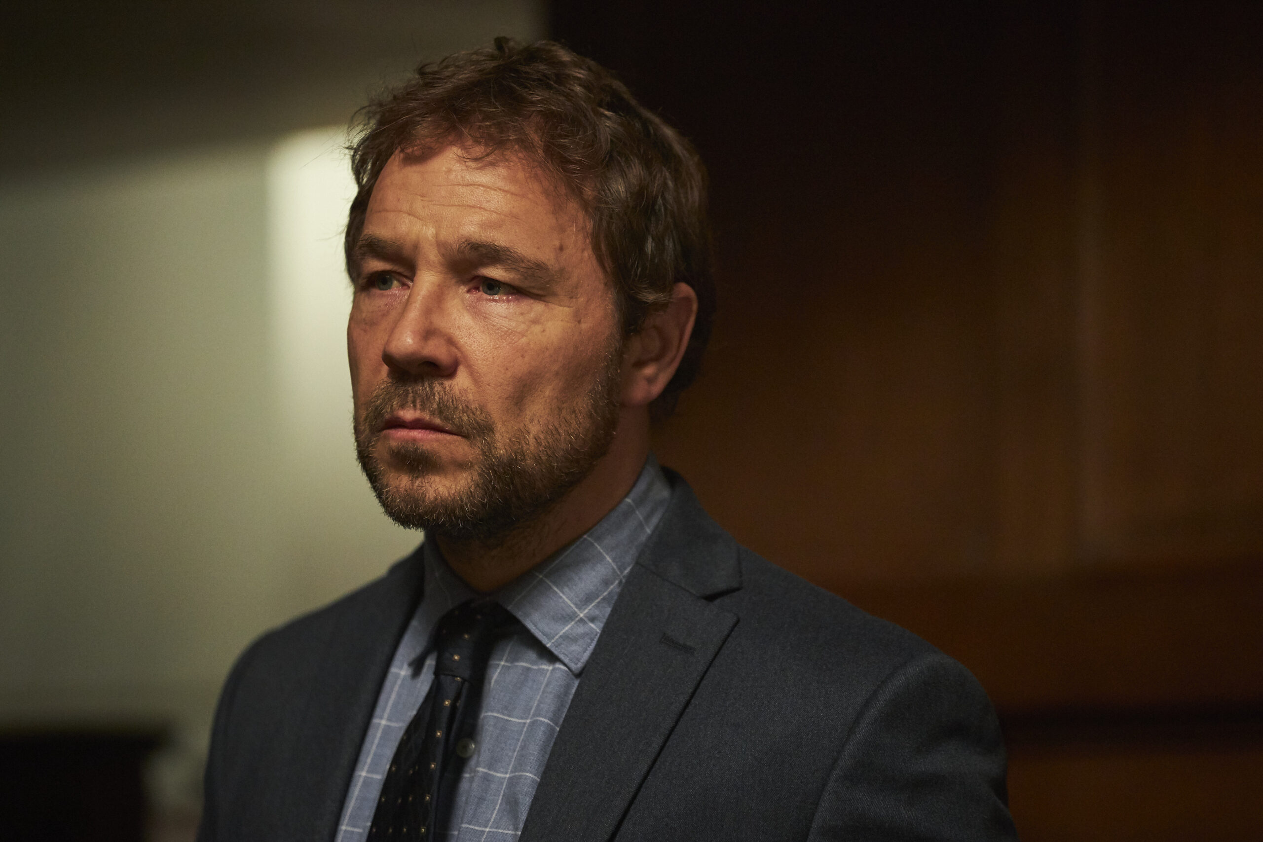 Matthew Collins looks upset in a court room