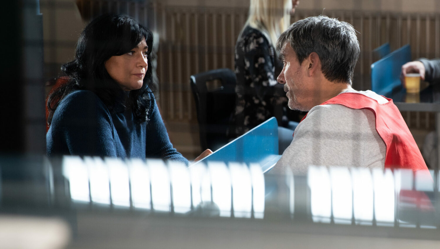 Moira looking at Cain as she visits him in prison in Emmerdale