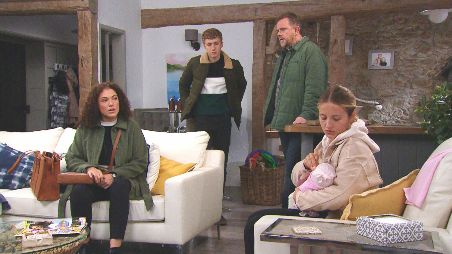 Dan and Noah watch as a social worker visits with Amelia and Esther on Emmerdale