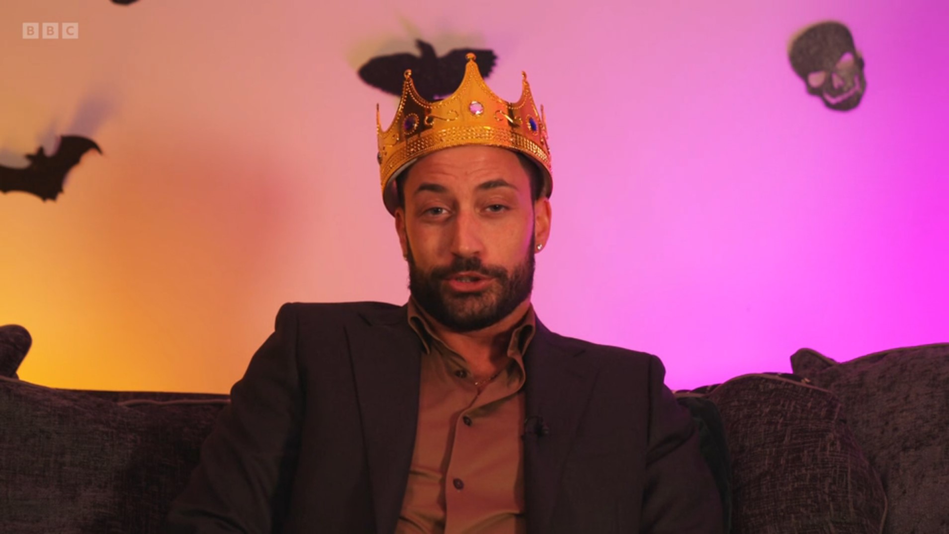 Giovanni wearing crown