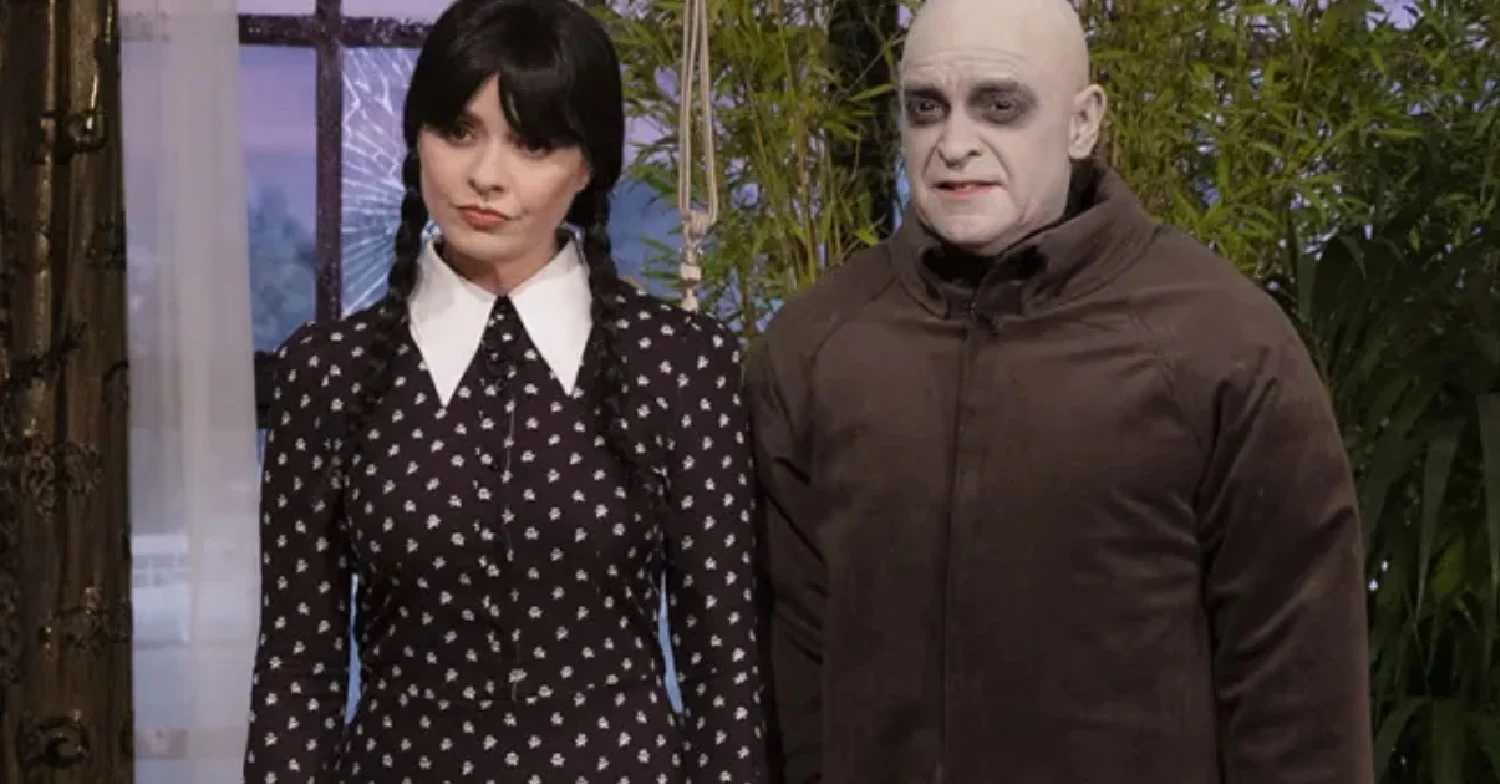 Phillip Schofield as Uncle Fester and Holly Willoughby as Wednesday Addams on This Morning 