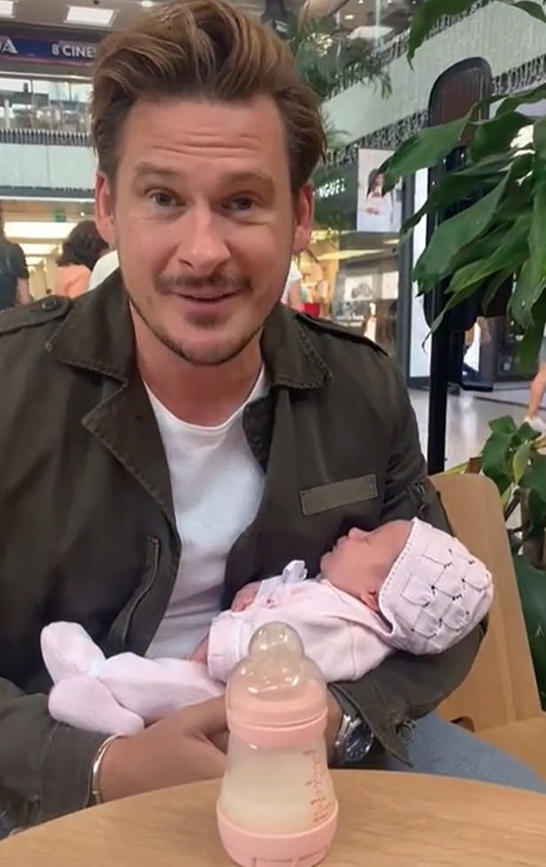 Strictly star Lee Ryan holding his new baby