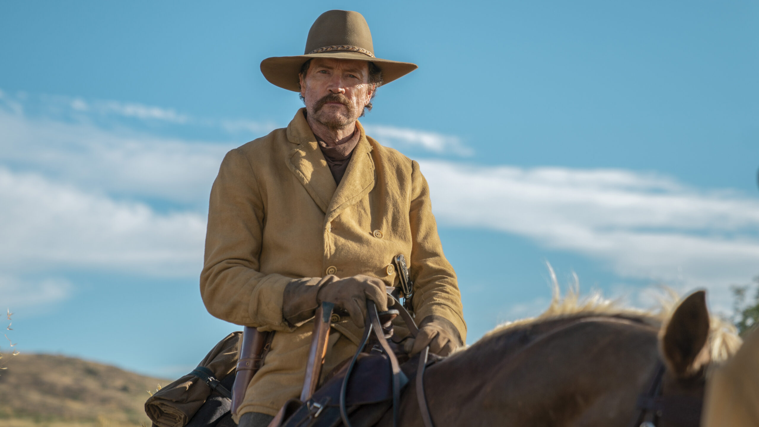 Thin Kelly sits on a horse in The English