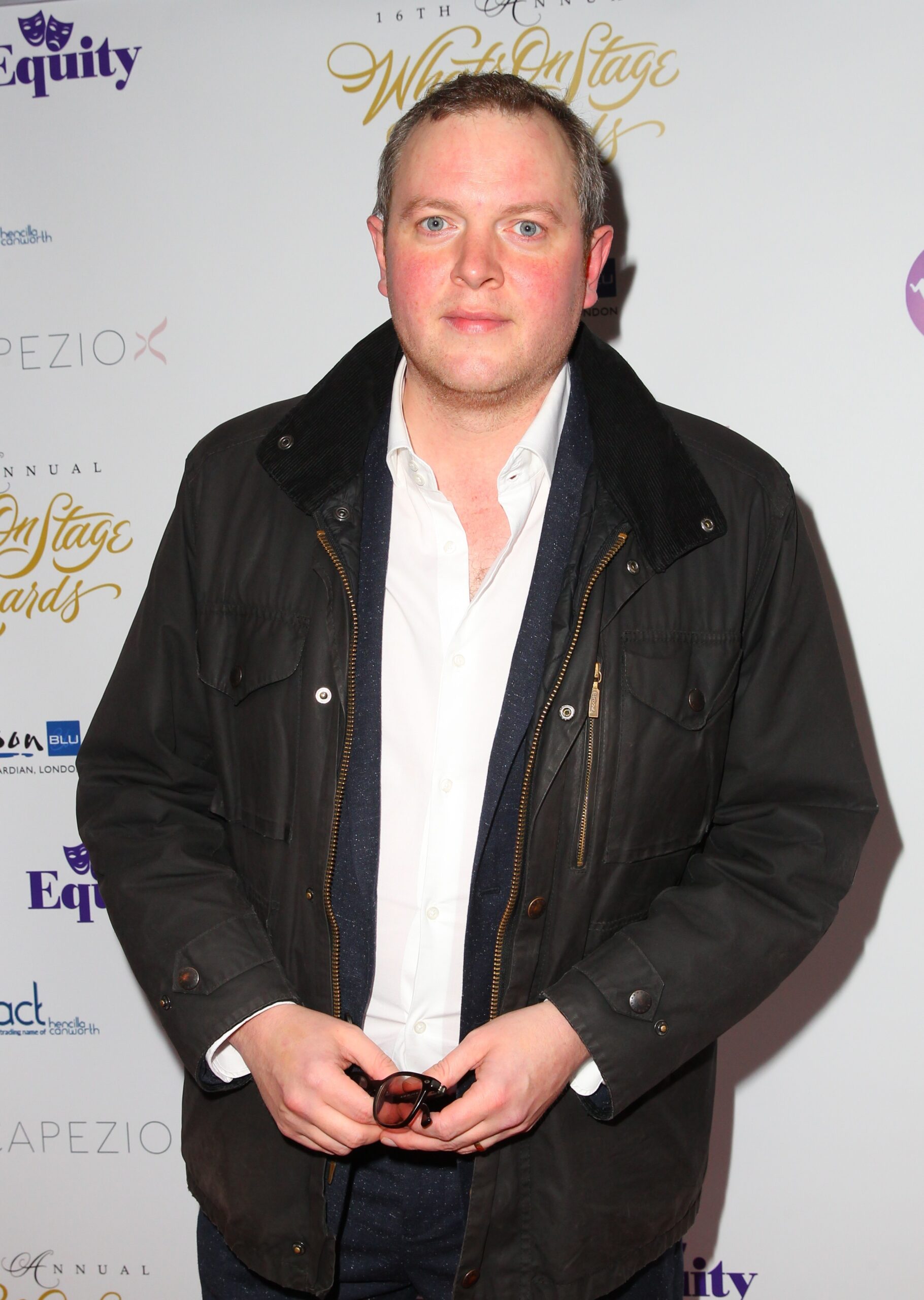 Miles Jupp wearing a black jacket on the red carpet