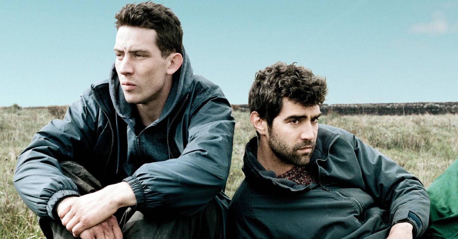 Josh O'Connor and Alec Secareanu sit back to back in God's Own Country