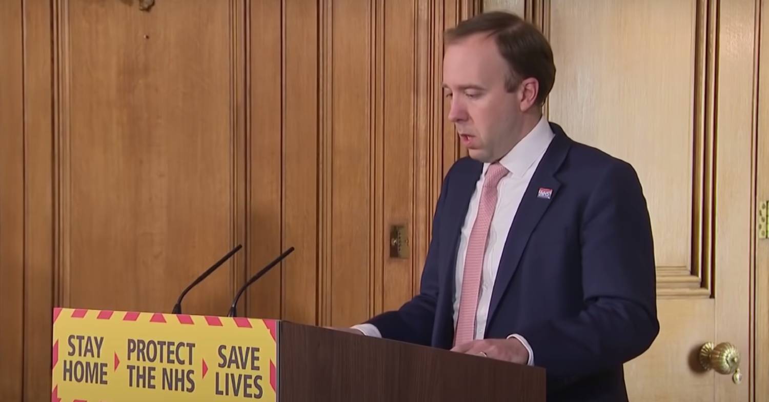 Matt Hancock speaks during a press conference at a lecturn