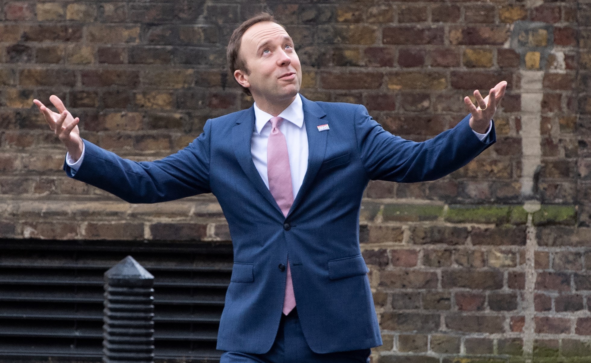 I'm A Celebrity star Matt Hancock reaches his arms out and looks up