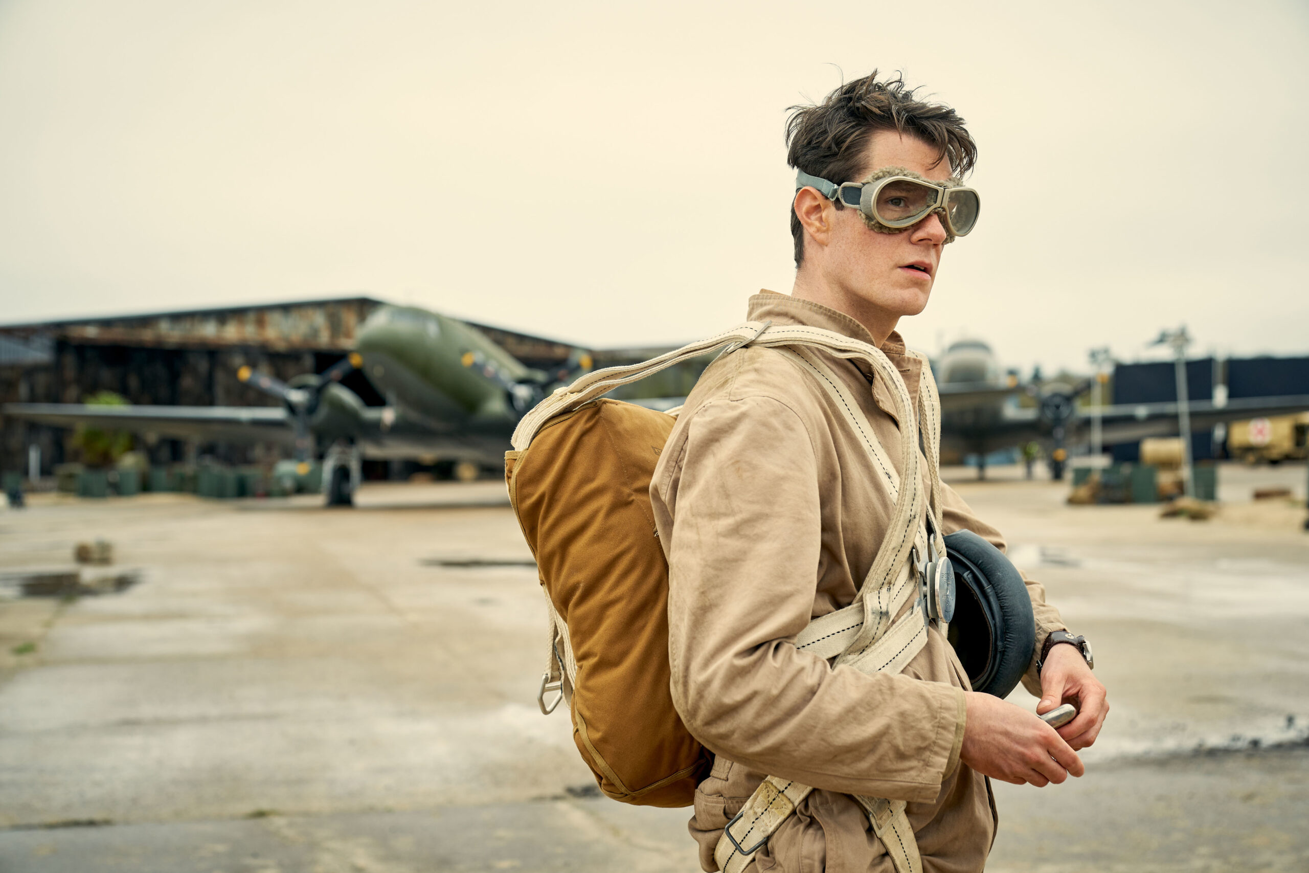 Connor Swindells wearing a parachute in SAS Rogue Heroes