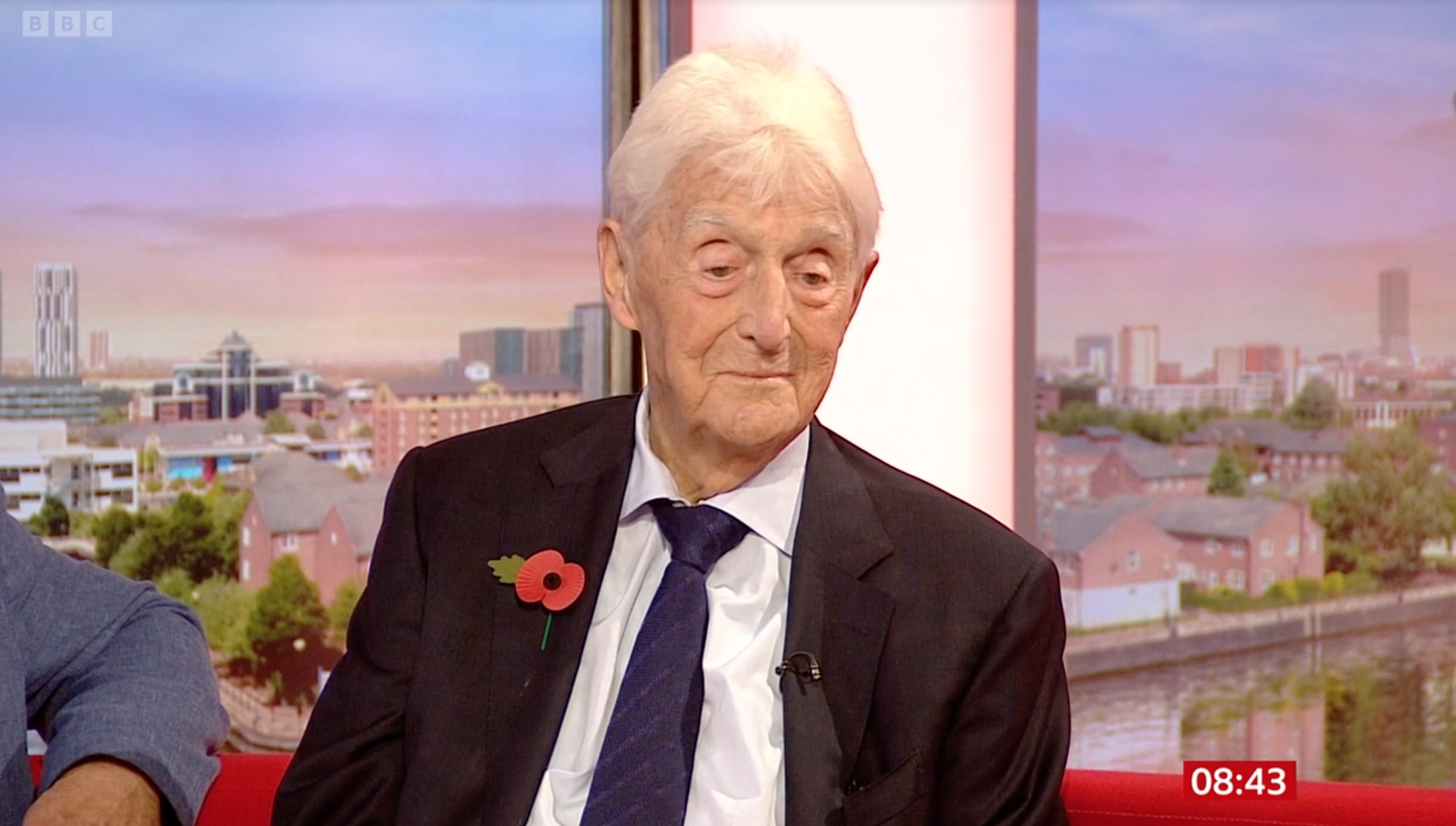 Michael Parkinson on BBC Breakfast wearing a suit