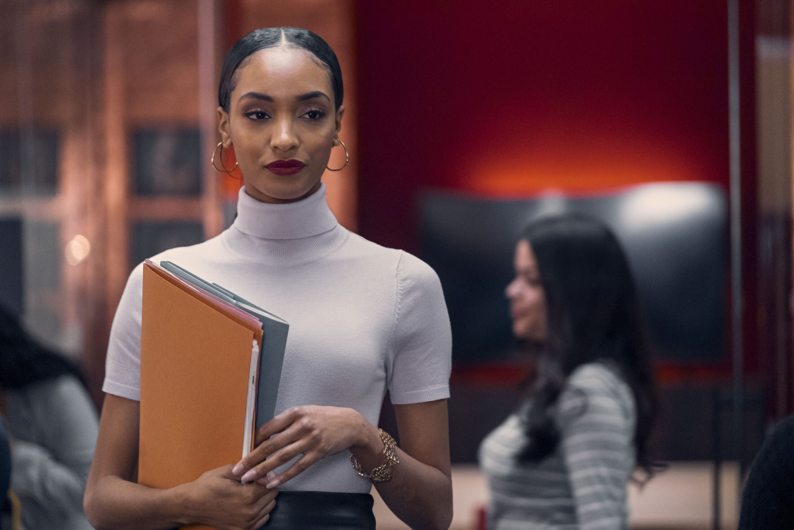 Davina smiles as she walks away in Riches