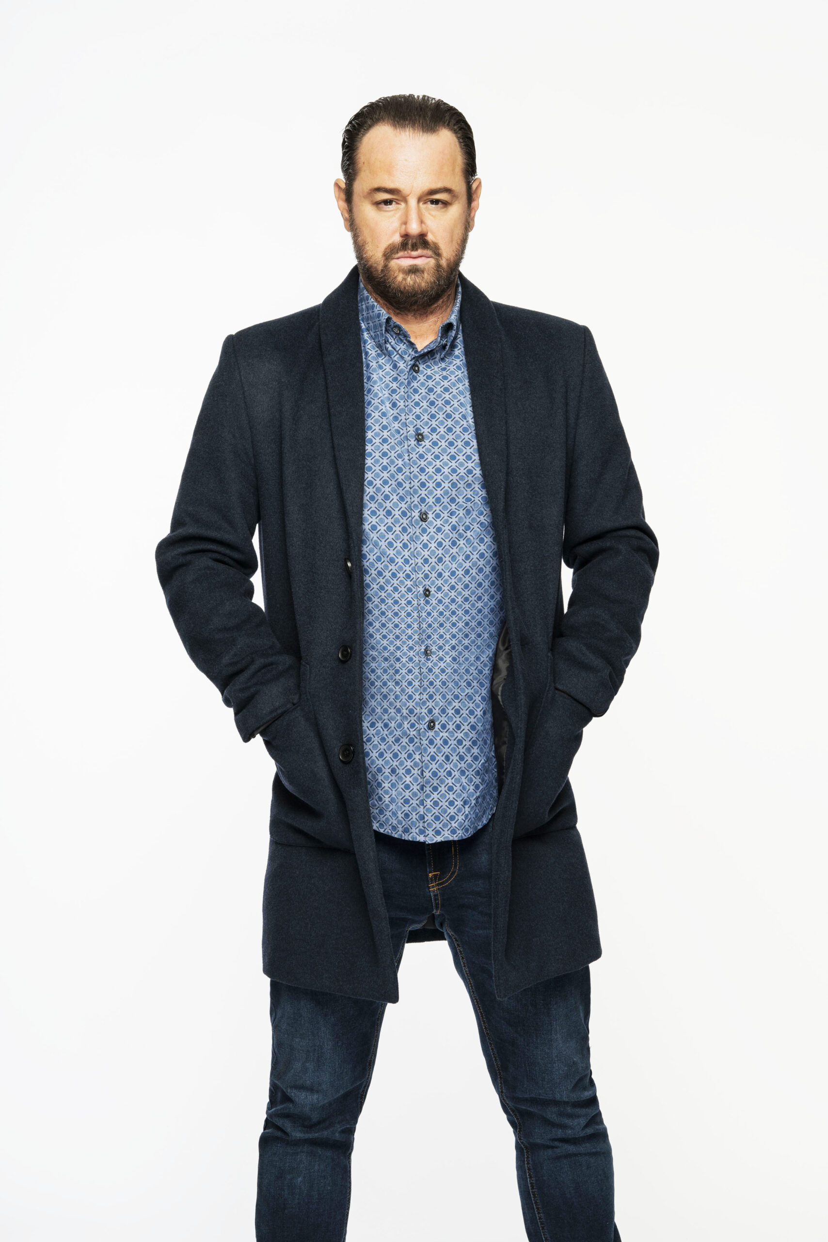 Mick Carter (Danny Dyer) poses in dark jacket in EastEnders