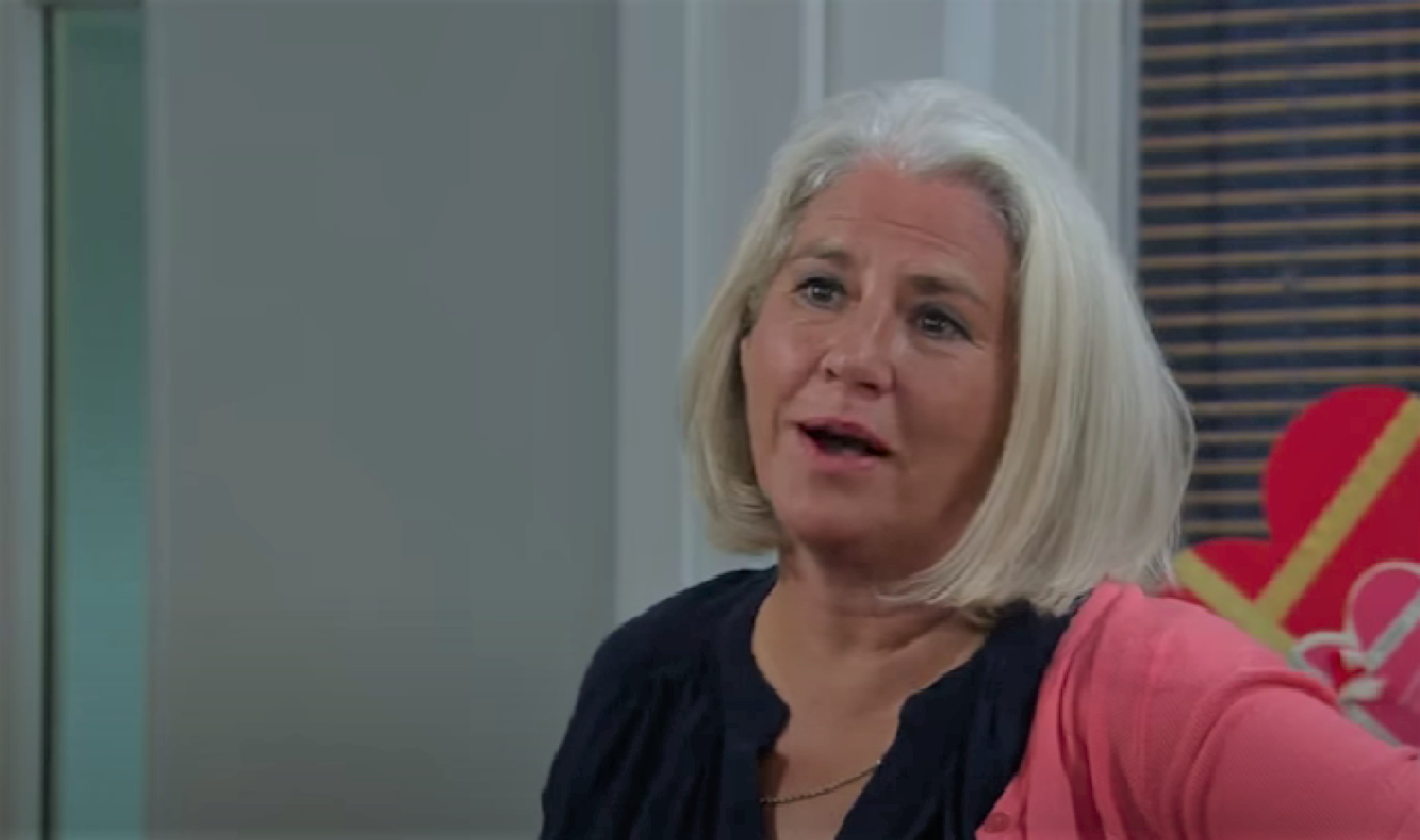 Joanie Wright talking and looking smug in Emmerdale 