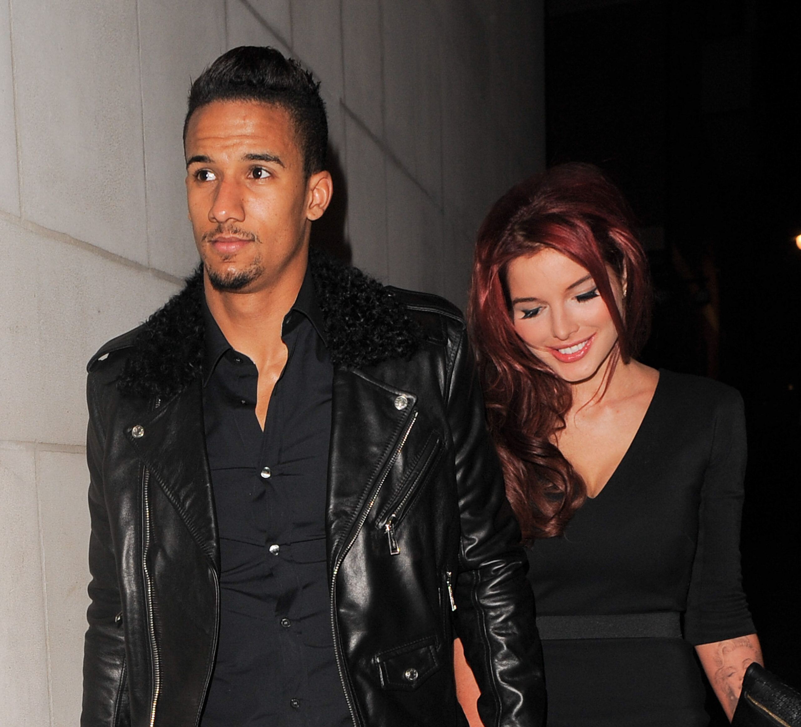 Helen Flanagan and partner Scott Sinclair, hand in hand, smiling